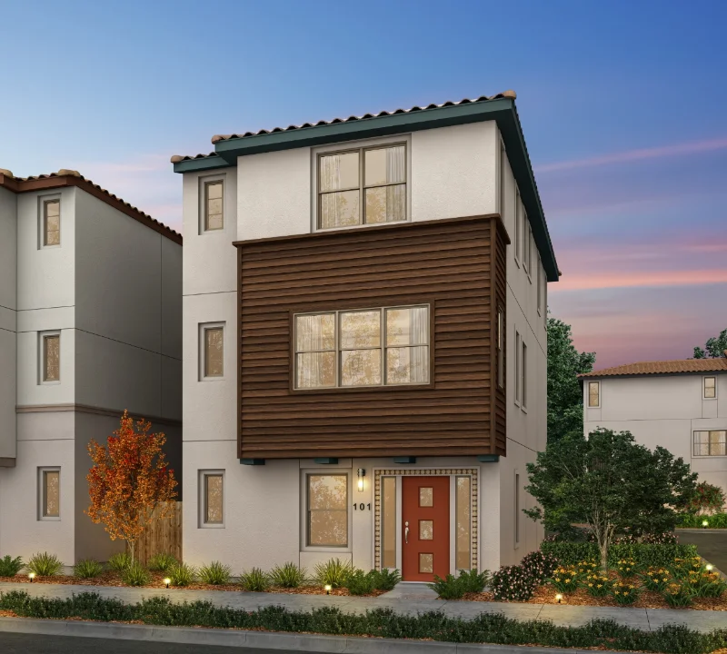 An eye-level exterior rendering of a three-story single-family home at Chattleton Place featuring a prominent dark wood-paneled section on the second story and surrounded by landscaped bushes with subtle outdoor lighting.